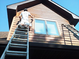 staining home siding